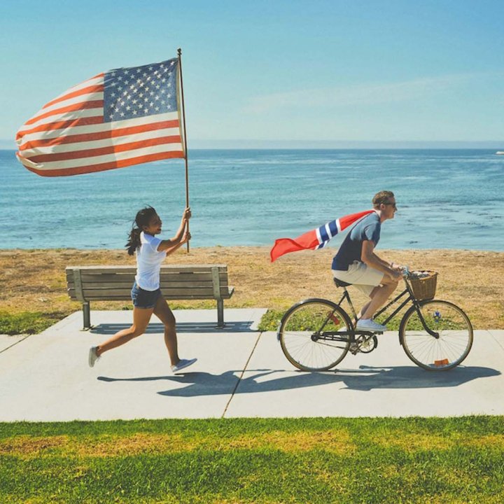 Cycling Man Running Woman US Norwegian Flags