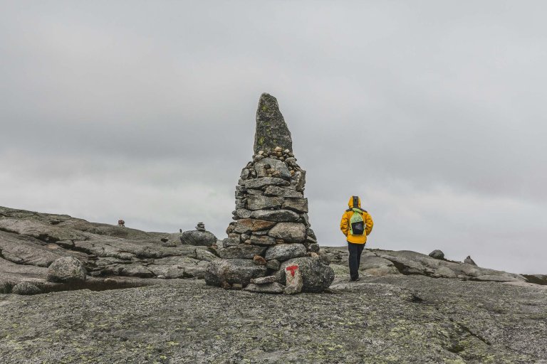 Person by a cairn.