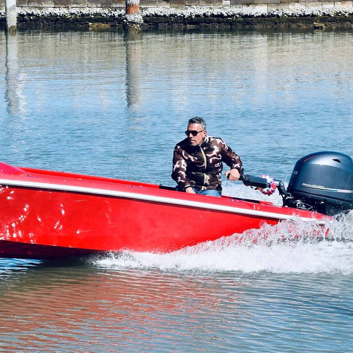 Man Red Boat Engine Powering Website