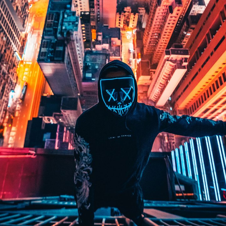 Man with Mask Hanging on Building Content Headless